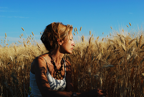 a beautiful woman in a wheat field