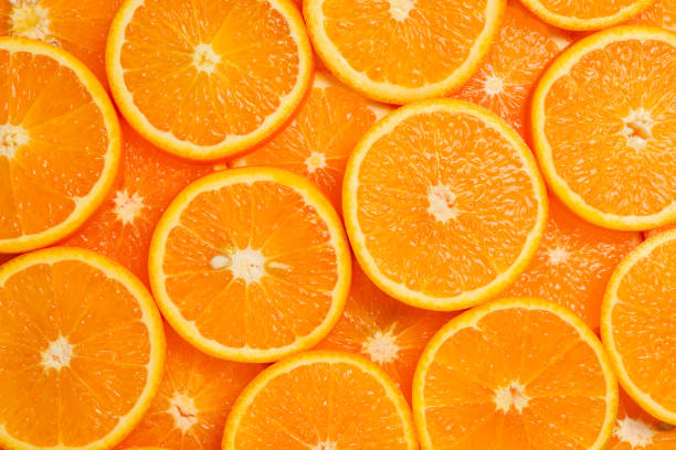 istock Slices of oranges as a background, top view. 1139714065