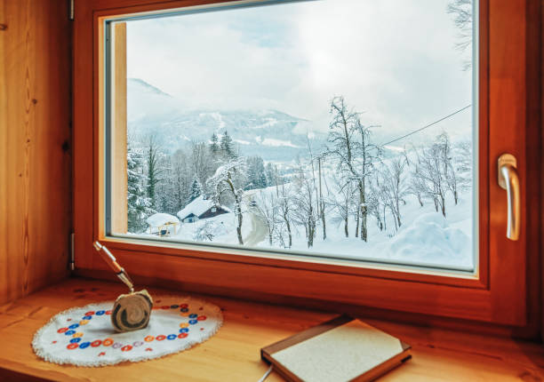 istock Window with view on Alpine mountains in snowy winter Austria 1139715278