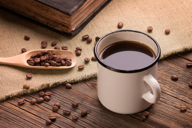 istock Vintage iron mug filled with hot freshly brewed coffee. 1139719119