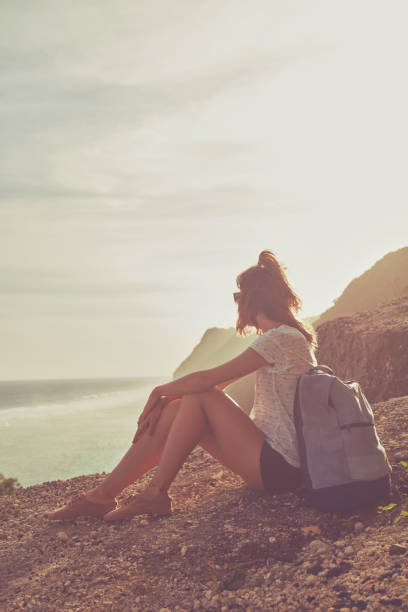 istock Tourist girl with backpack enjoying the view. 1139720989