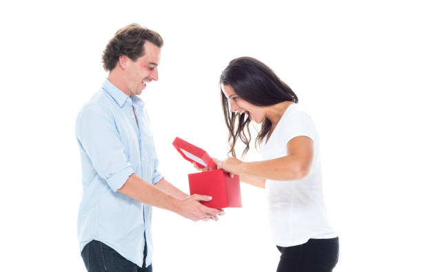 istock Husband giving a gift to his wife 1139721211
