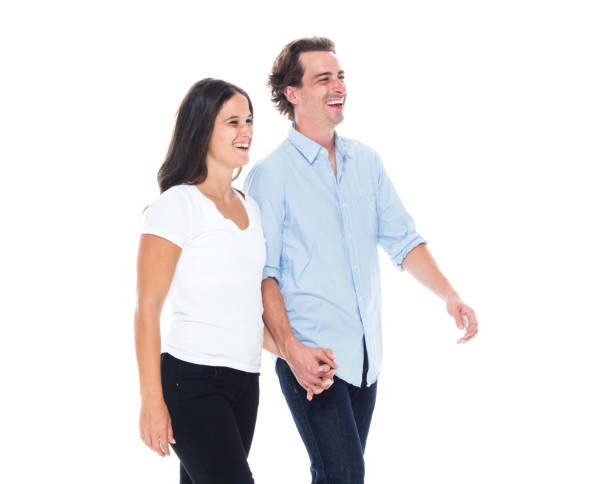 istock Happy couple walking and holding hands 1139721235