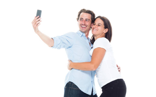 istock Happy man is taking a selfie with his girlfriend 1139721250