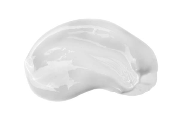 crème liquide cosmétique d’isolement sur le fond blanc - paint peel peeling white photos et images de collection