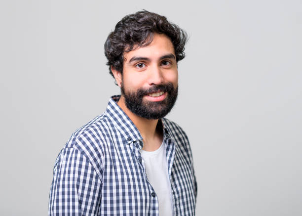 istock Handsome man in checked shirt on gray background 1139722172