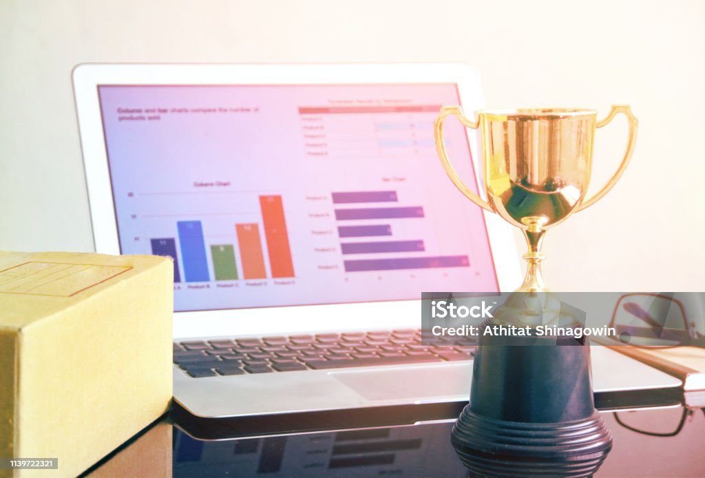 Viewpoint Computer Prize Winner Trophy With Computer Notebook On Working Table Ecommerce Concept ...