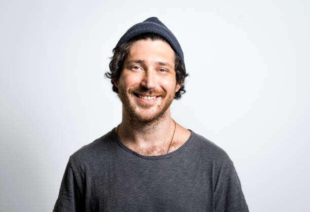 istock Portrait of man smiling on gray background 1139722828
