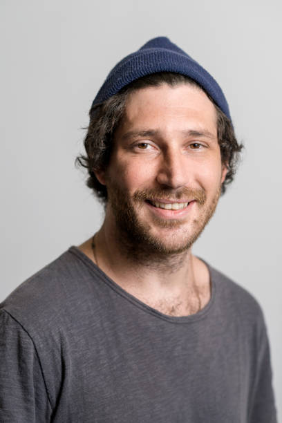 istock Smiling mid adult man wearing knit hat 1139722875