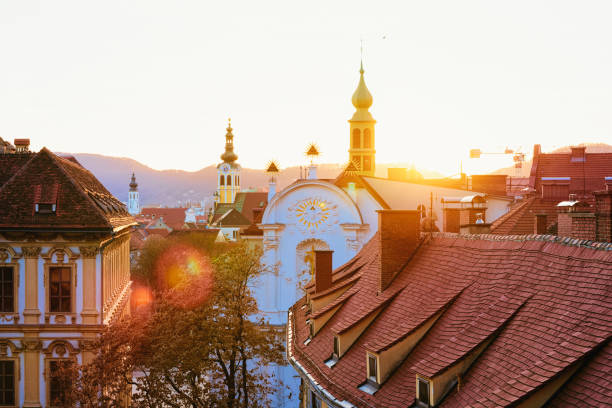 Panoramic view and cityscape at Old city in Graz in Austria. Styria in Europe. Rooftop view from Schlossberg castle hill. Sunset  over Austrian town.