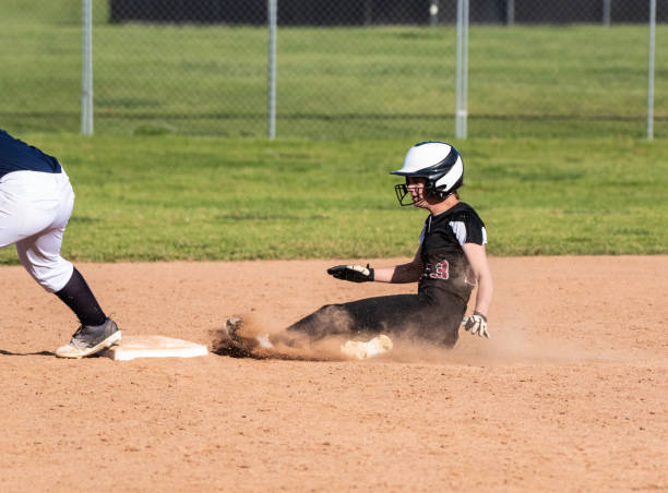 istock Competing in high school softball game. 1139725267