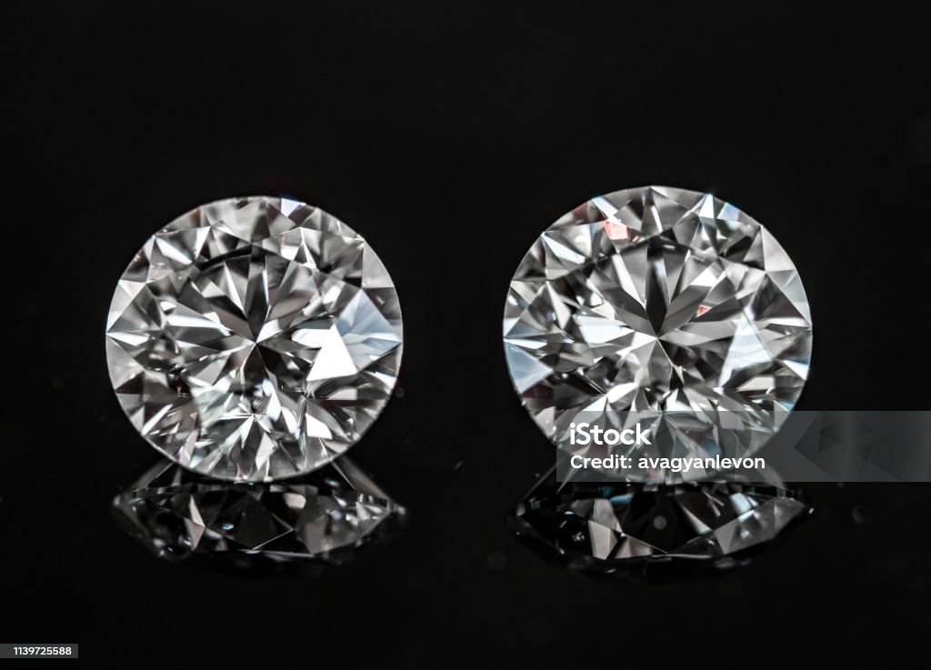 Diamonds Round Cut Diamond gemstone on the black background Diamond - Gemstone Stock Photo