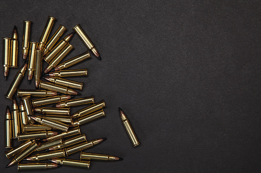 Rifle cartridges on a black background