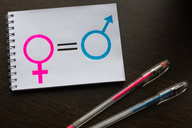 istock notebook with gender equality women and men symbols 1139728690