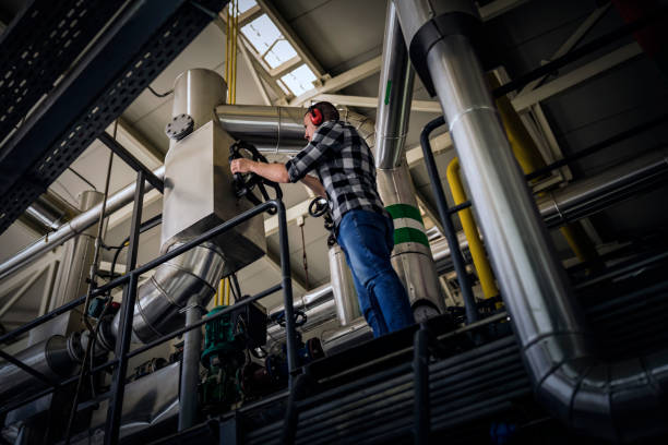 istock Young Technician is Inspecting Heating System in Boiler Room 1139731553