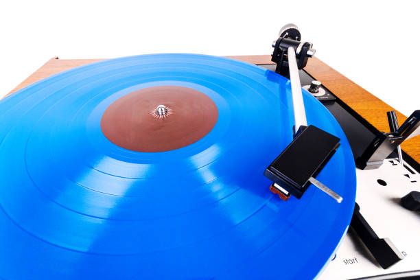 istock Vintage turntable with a blue vinyl isolated on white 1139734389