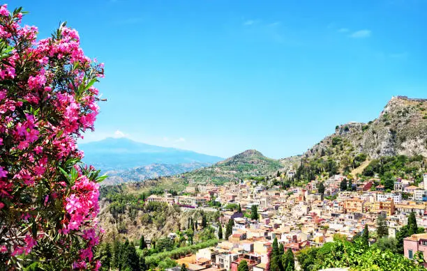 Taormina town with Mount Etna on background