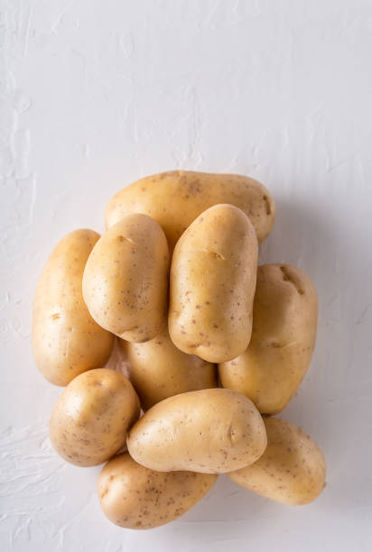 istock Raw organic potatoes on a white background 1139736463