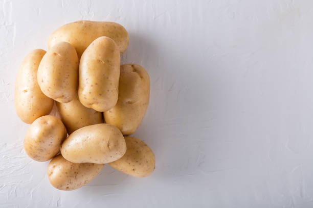 istock Raw organic potatoes on a white background 1139736545
