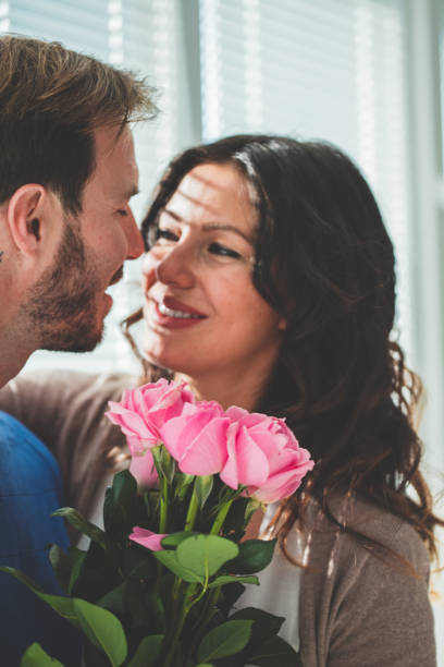 istock Couple with bouquet of roses 1139737149