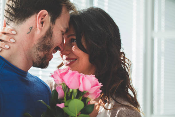 istock Man giving roses to her wife 1139737151