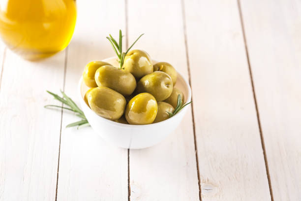 istock Bowl with canned olives on white background 1139737226