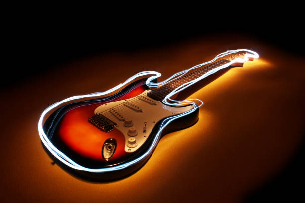 istock Electric guitar with edge glow on dark blue background. Lightpainting technique. 1139741059