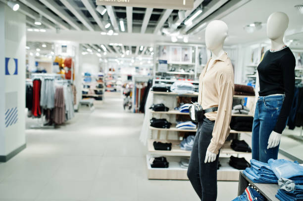 istock Two mannequin at jeans clothes store. 1139741164