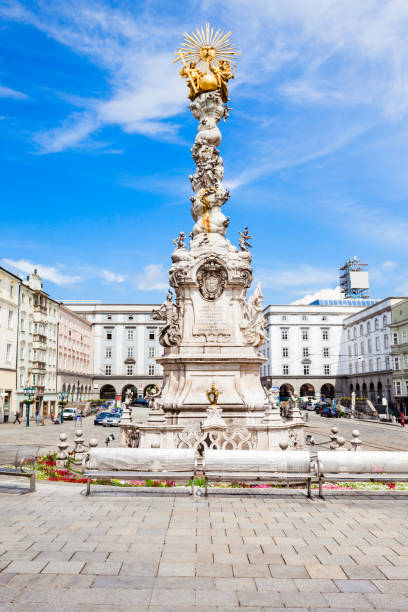 Main Square main square, Linz Holy Trinity column on the Hauptplatz or main square in the centre of Linz, Austria. Linz is the third largest city of Austria. linz austria stock pictures, royalty-free photos & images