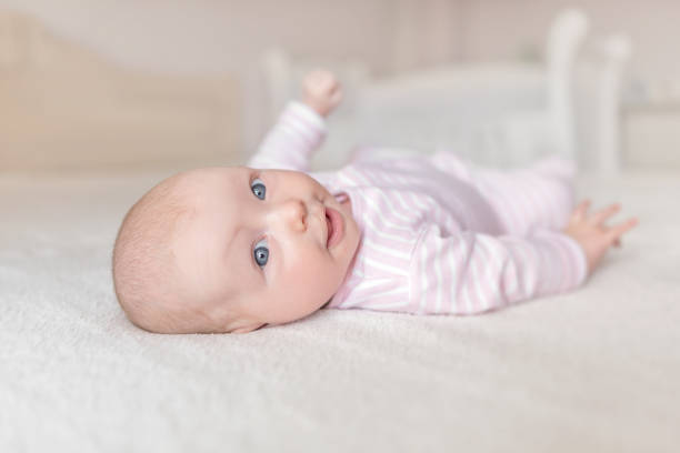 istock Little baby in a white crib. 1139743221