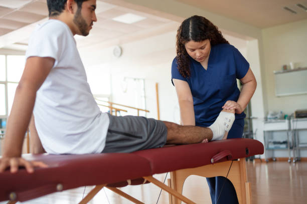 istock Physical therapist checking patient's foot 1139743280