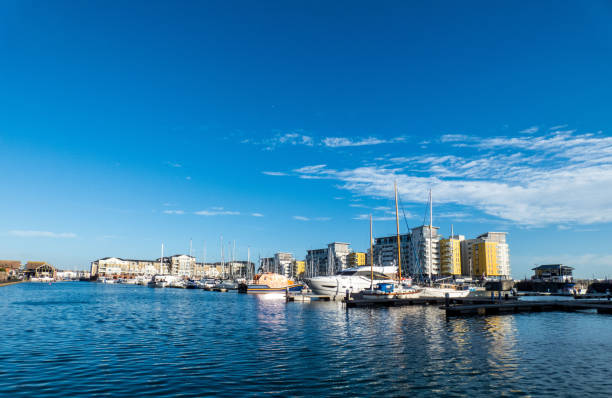 istock Harbour in Eastbourne with yahts, blue sky and water 1139743876