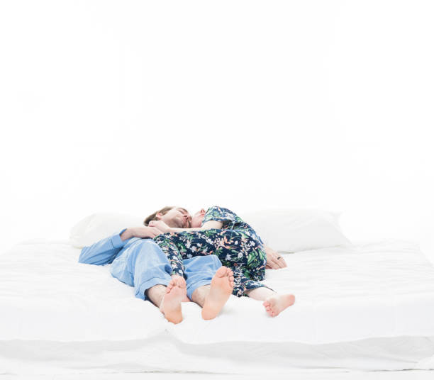 istock Heterosexual couple lying on bed and sleeping 1139743905