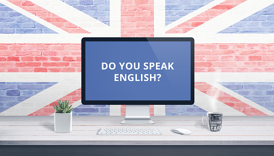 Do you speak English on computer display with a flag of Great Britain in the background. Online lessons concept.