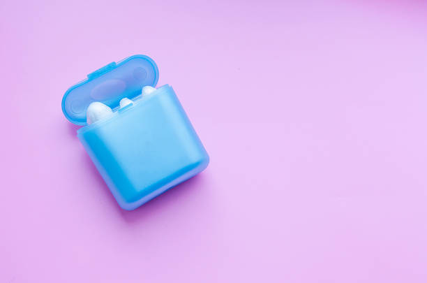 istock blue box with tampons for female menstruation on a pink isolated background 1139751140