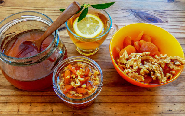 istock Green tea with lemons and honey mix with apricots and nuts 1139752208