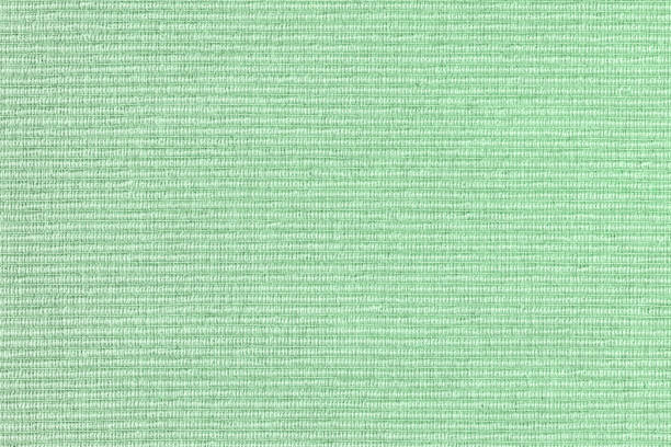 istock Dense woven ribbed texture. Upholstery fabric close up. Empty light green background for layouts. 1139754727