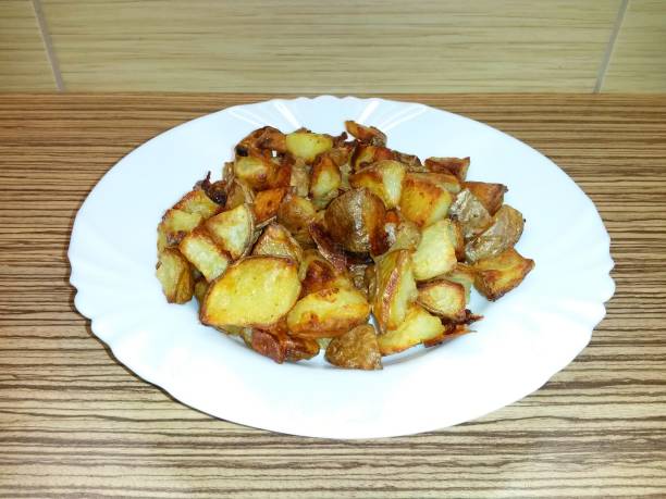 istock Roasted potatoes laid on a white porcelain plate 1139754736