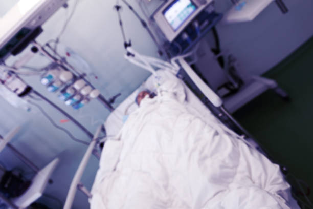 istock ICU ward interior with patient lying in bed, unfocused background 1139755634