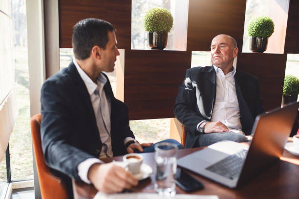 istock Senior businessmen having a work discussion with a cup of coffee 1139756824