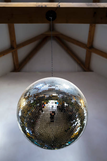 istock Mirror, brilliant, reflective disco ball hanging on a chain from the ceiling 1139760015