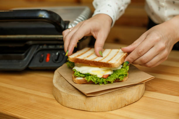 istock put the melted cheese in a sandwich. cooking juicy sandwich 1139760140