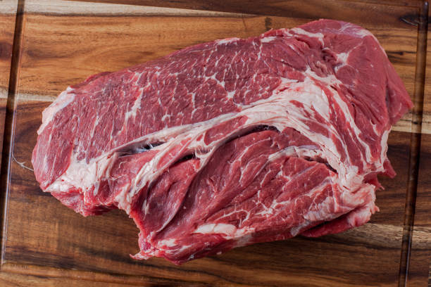 istock Beef meat on wooden cutting board as  background 1139761732