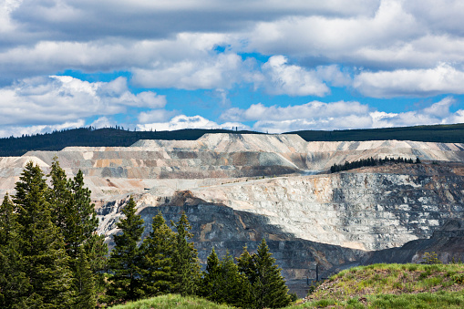 Open-pit mine in the beautiful wilderness landscape of the Canadian Rockies of British Columbia, Canada.