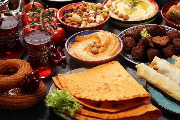 istock Middle eastern or arabic dishes and assorted meze, concrete rustic background. Falafel. Turkish Dessert Baklava with pistachio. Halal food. Lebanese cuisine 1139769965