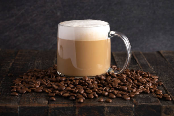 istock A Cafe Latte Coffee in a Clear Glass Mug in a Dark Environment 1139770731