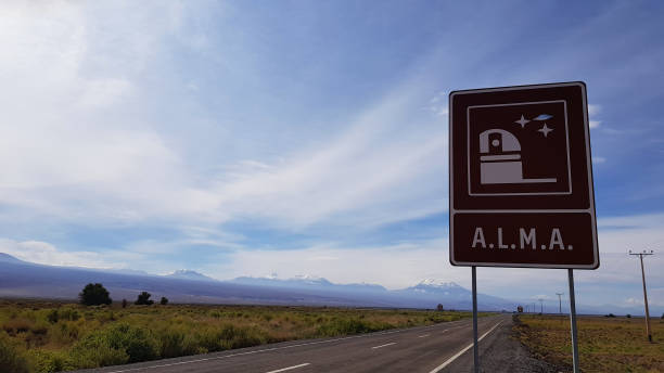 The road sign indicating the main entrance to the Atacama Large Millimeter Array (ALMA), in the Atacama Desert of northern Chile stock photo