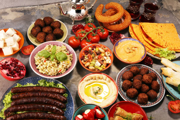 Middle eastern or arabic dishes and assorted meze, concrete rustic background. Falafel. Turkish Dessert Baklava with pistachio. Halal food. Lebanese cuisine