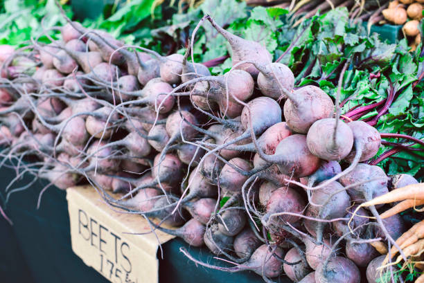 Many Raw Beets for Sale at a Farmers Market Stall