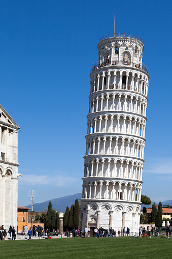 Pisa, Italy - March 31 2019: The Leaning Tower of Pisa (Italian: Torre pendente di Pisa) is the campanile of the Pisa Cathedral.